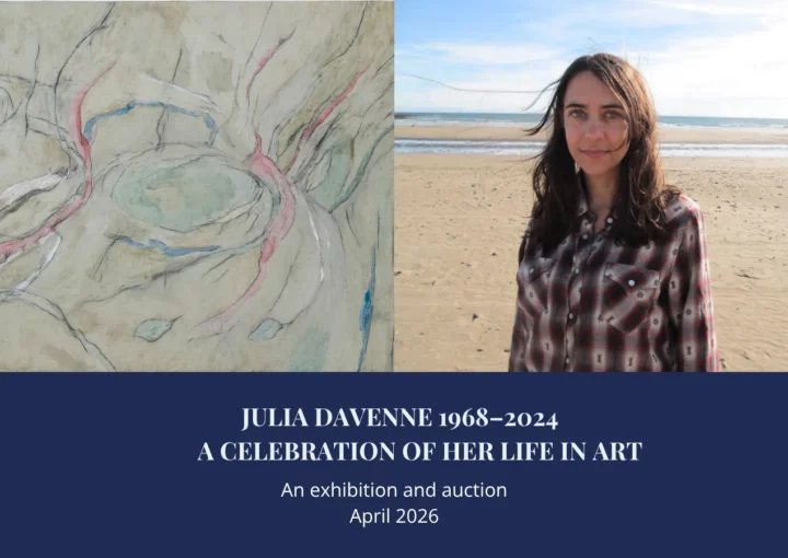 An image of a smiling woman with long brown hair. She is standing on a sandy beach with blue skies behind her. The text reads JULIA DAVENNE 1968–2024 A CELEBRATION OF HER LIFE IN ART. An exhibition and auction April 2026 Net proceeds to The CJD Support Network’s research aims.