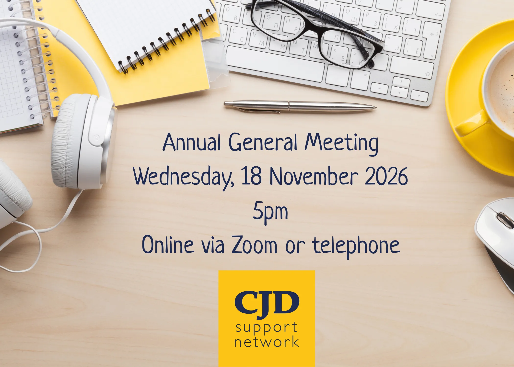 Image shows a desk with headphones, keyboard, glasses, a cup of tea and notebooks and includes the detail that the CJD Support Network will be held on Wednesday 18 Nomveber 2026 at 5pm via Zoom or Telephone.